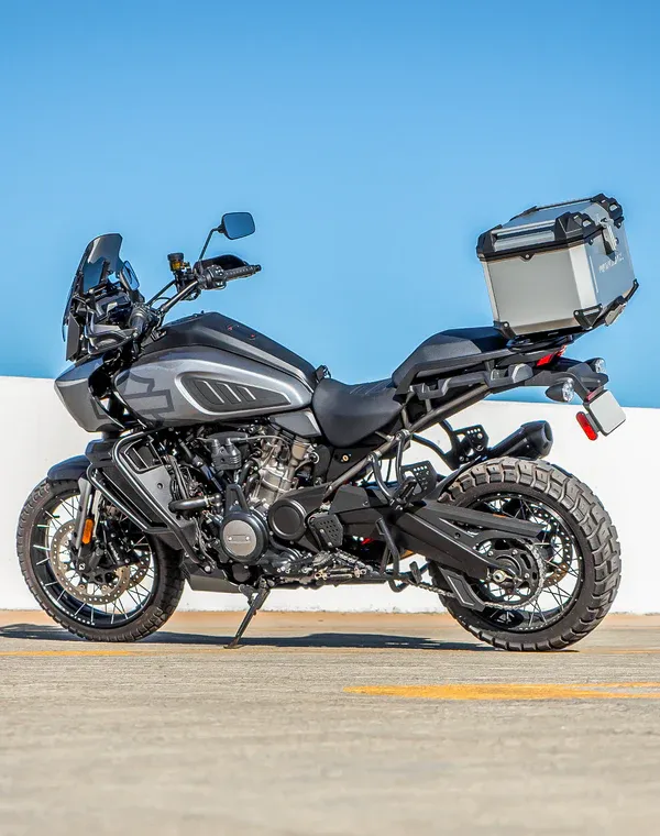 Adventure motorcycle with Viking Bags top case in a dark color scheme