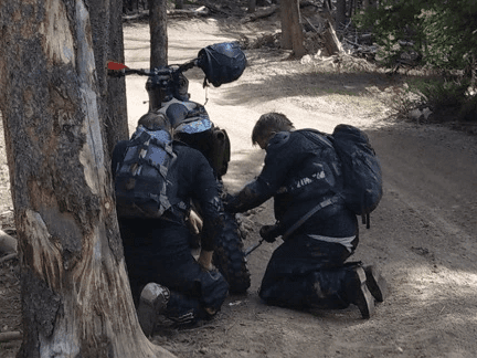 Riders working on bikes